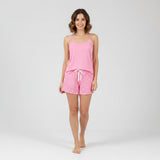 Women's pink cami pyjama set with printed drawstring shorts, full view on white background