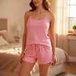 Close-up of pink cami PJ set with printed drawstring shorts - bedroom setting