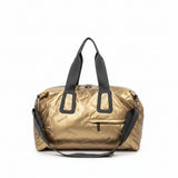 Bronze duffel bag with black straps on a white background