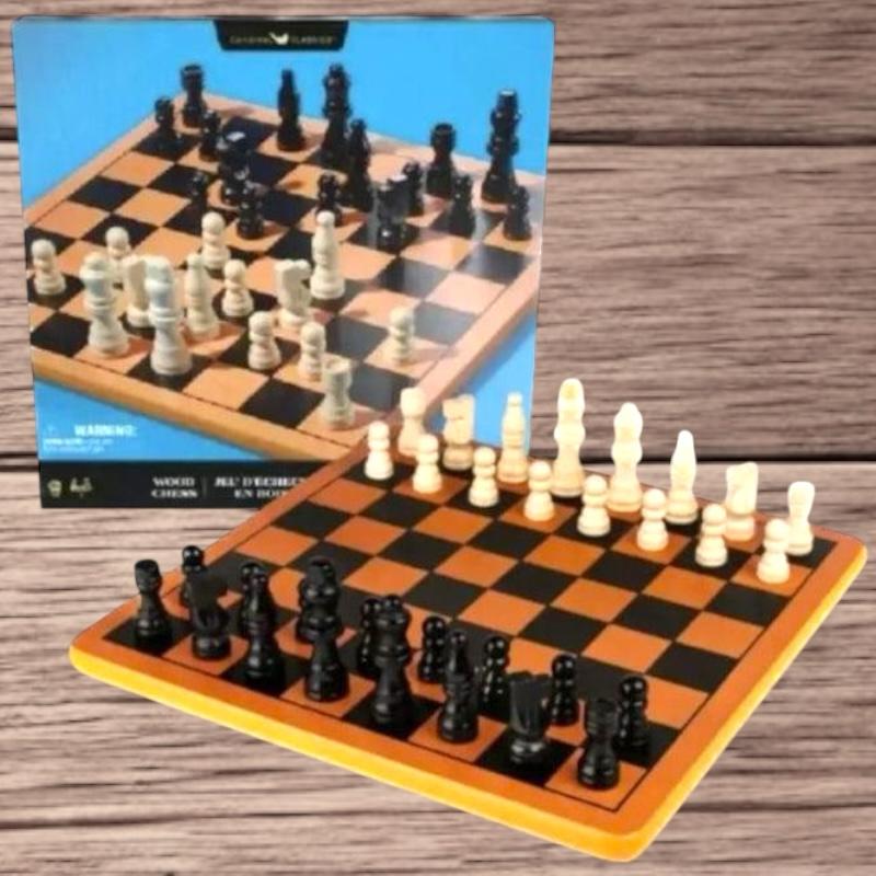 Wooden chess board set up in front of its retail box on a wood grain background