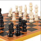 Close up of the yellow rimmed board corner with cream and black turned wooden pieces