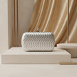 Silver woven metallic evening clutch with knot clasp
