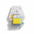 Yellow and blue 4x4 magic cube in a white blister pack with dinosaurs