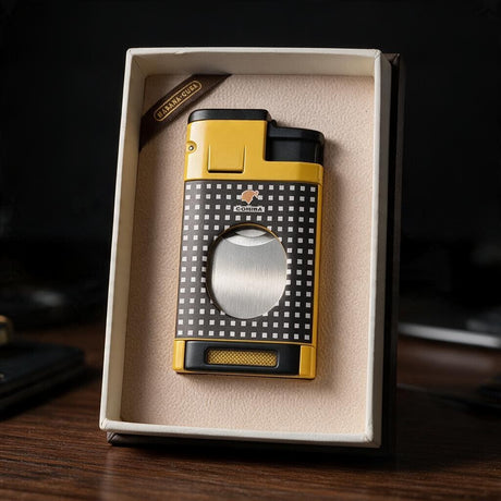 Yellow cigar lighter with a black checkered front and oval cigar cutter in a cream box