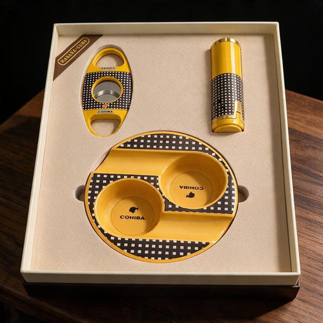 Yellow checkered twin bowl cigar ashtray with matching oval cutter and tube lighter in a cream box