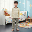 Kids cream pajama set with navy trim top and black striped pants