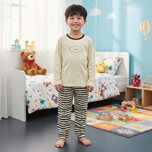 Kids cream pajama set with navy trim top and black striped pants