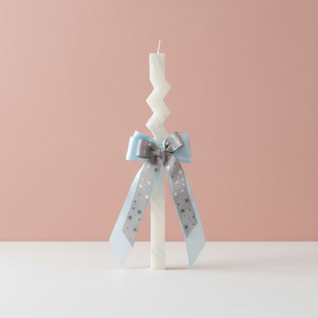 Zigzag candle with a silver star print ribbon bow