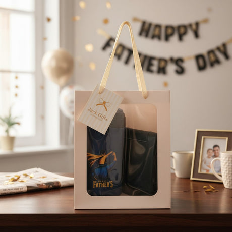 Gift box with Father's Day theme on a table with decorative elements.
