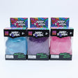 Jolly Swish gummy bears packaging on a cardboard surface with a blurred background