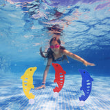 Girl swimming underwater with colorful dolphin toys in a pool