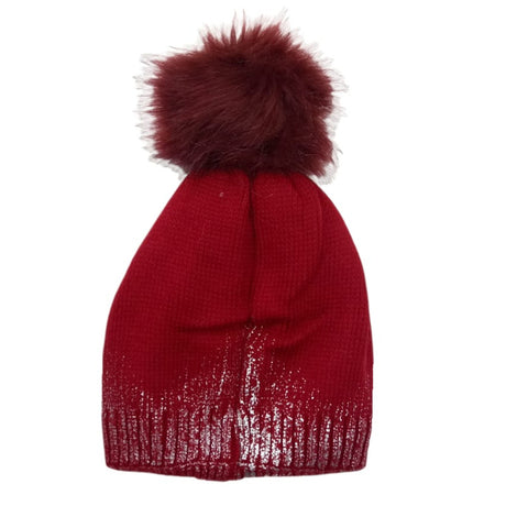 Burgundy knitted beanie with a silver sparkle band and fur pom on white